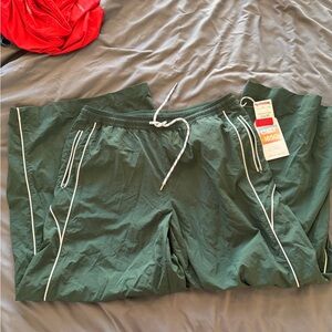 Green track pants